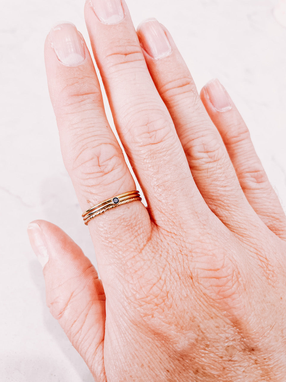 3 Stacker rings worn on hand by lady startup Australian jewellery label, AW Boutique.