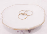 Load image into Gallery viewer, 3 stacker rings laying on trinket dish by lady startup Australian jewellery label, AW Boutique.
