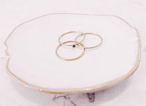 3 stacker rings laying on trinket dish by lady startup Australian jewellery label, AW Boutique.