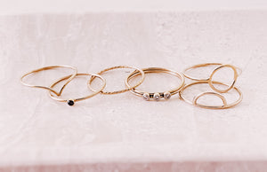 AW Boutique's gold filled stackable rings on a jewellery tray.