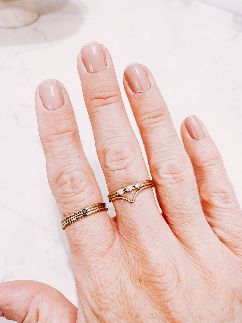 Gold Filled stacking rings worn on hand by lady startup Australian jewellery label, AW Boutique.