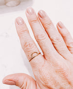 Load image into Gallery viewer, AW Boutique Sun Gold Filled Stackable ring on a hand.
