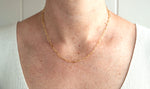 Load image into Gallery viewer, Model wearing AW Boutique&#39;s Paperclip Chain Necklace at the extendable 17 inches length.
