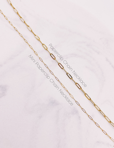 Mini Paperclip Chain Necklace and Paperclip Chain Necklace laying next to each other to compare the size difference of the two links.  AW Boutique gold filled jewellery.
