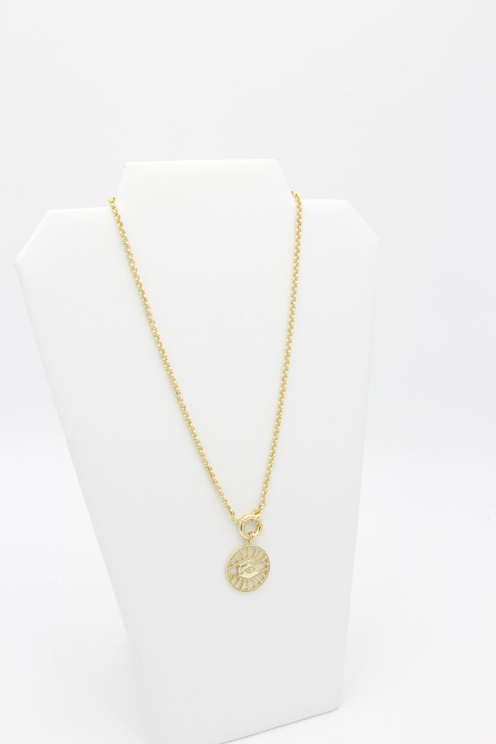 Gold filled evil eye medallion pendant charm necklace. This is a bold gold necklace design. Australian jewellery brand AW Boutique.