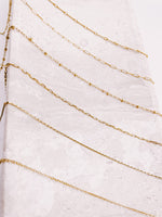 Load image into Gallery viewer, 6 layering chains draped across a tray from AW Boutique gold filled jewellery.
