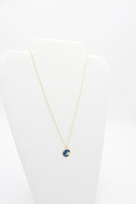 Load image into Gallery viewer, AW Boutique&#39;s Zodiac Astro Coin is a dainty pendant full of sparkle and shine.  This piece adds a pop of colour to your everyday wear and at 18 inches is a great length to mix and layer your other chains with.  Proudly wear either your own star sign or the star sign of a loved one close to your heart.  Zodiac shown is Taurus.
