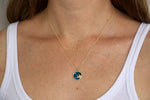 Load image into Gallery viewer, Model wearing AW Boutique&#39;s Zodiac Astro Coin is a dainty pendant full of sparkle and shine.  This piece adds a pop of colour to your everyday wear and at 18 inches is a great length to mix and layer your other chains with.  Proudly wear either your own star sign or the star sign of a loved one close to your heart.  Zodiac shown is Taurus.
