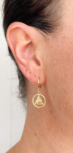 Load image into Gallery viewer, All-Seeing Eye or Eye of Providence protection symbol on a gold filled huggie earring.
