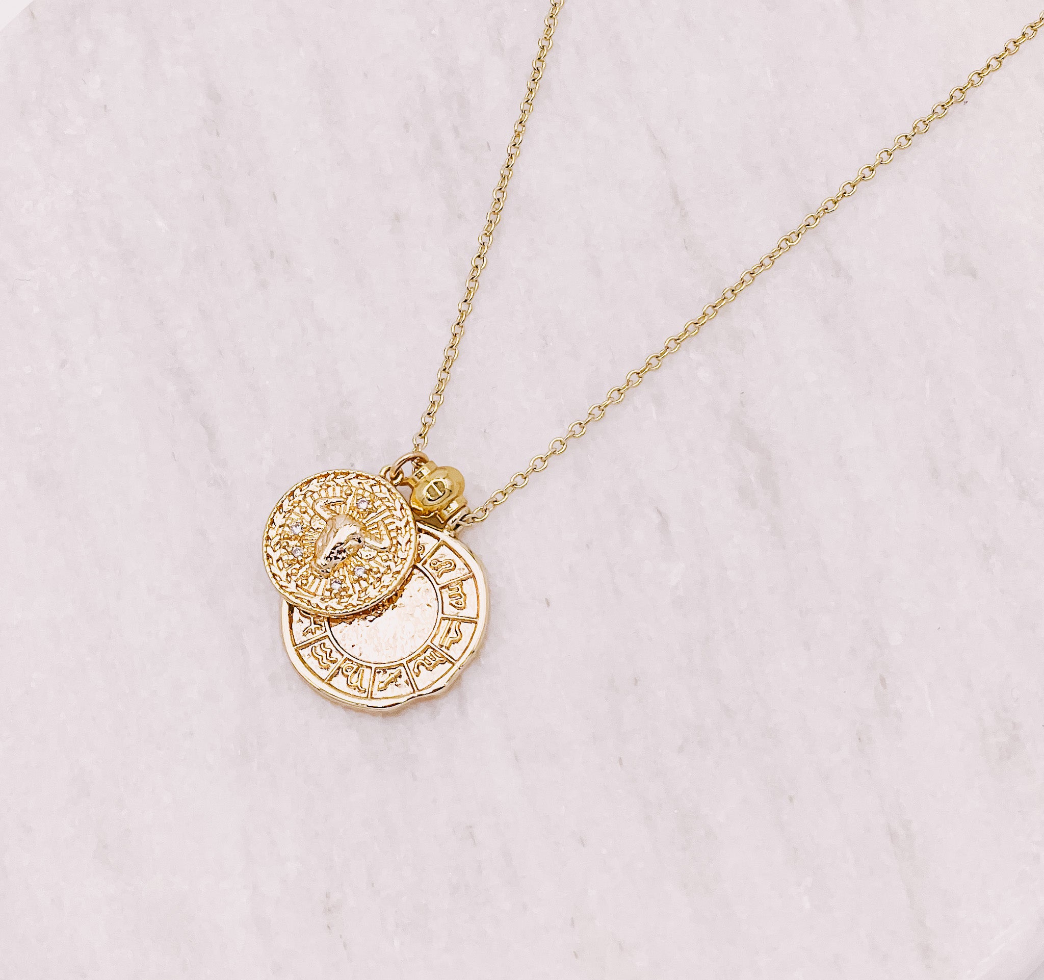 Gold filled zodiac star sign coin charm necklace. Australian jewellery brand AW Boutique. Part of the Celestial Collection. Necklace option shown is Taurus.