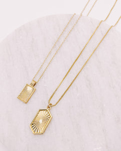 AW Boutique's gold filled 16 inch dainty necklace with a tag pendant featuring a sunburst patterned effect. Part of the Celestial Collection. Gold filled jewellery.  Pictured here with the Vintage Sunburst Necklace.