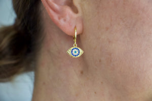 Gold filled huggie earrings with an evil eye charm.  Australian jewellery brand AW Boutique.