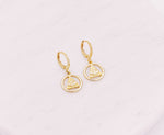 Load image into Gallery viewer, All-Seeing Eye or Eye of Providence protection symbol on a gold filled huggie earring.  
