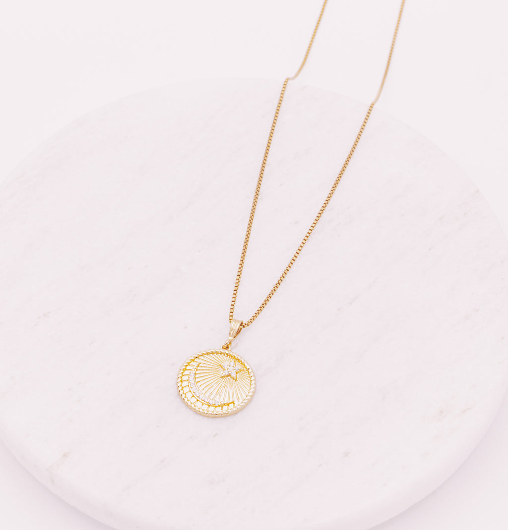 Celestial Coin pendant on a gold filled box chain necklace.  Pendant has a crescent moon and star.