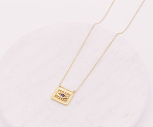 Evil Eye square pendant hanging from a dainty cable link gold filled chain necklace.  Evil Eye is a protective symbol and talisman.  Protection jewellery.