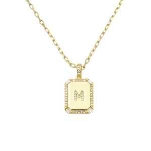 AW Boutique's gold filled 16 inch cable chain necklace finished with a dainty initial pendant with cubic zirconia detail. M initial shown.