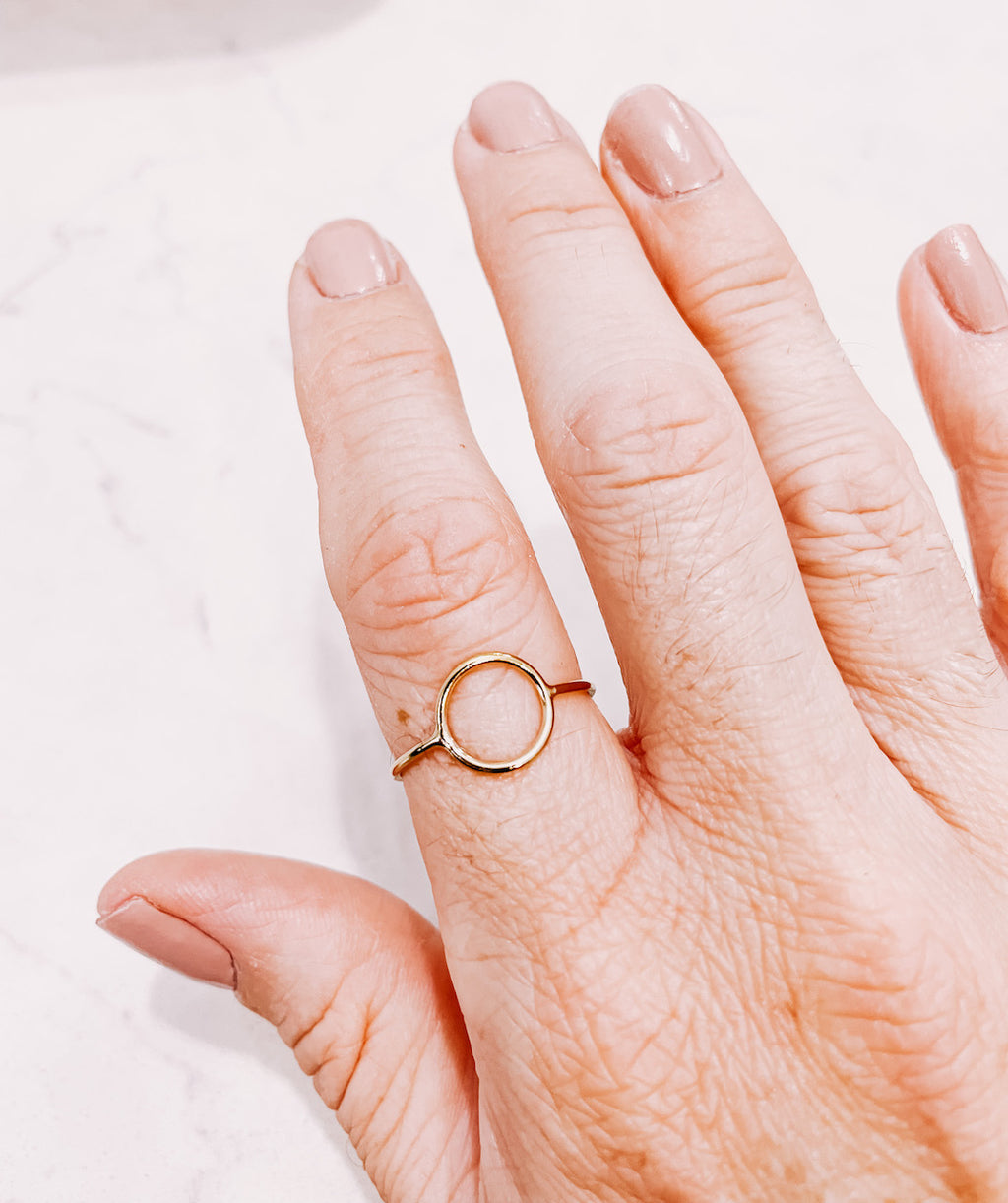 AW Boutique's Moon Gold Filled Ring on a hand.