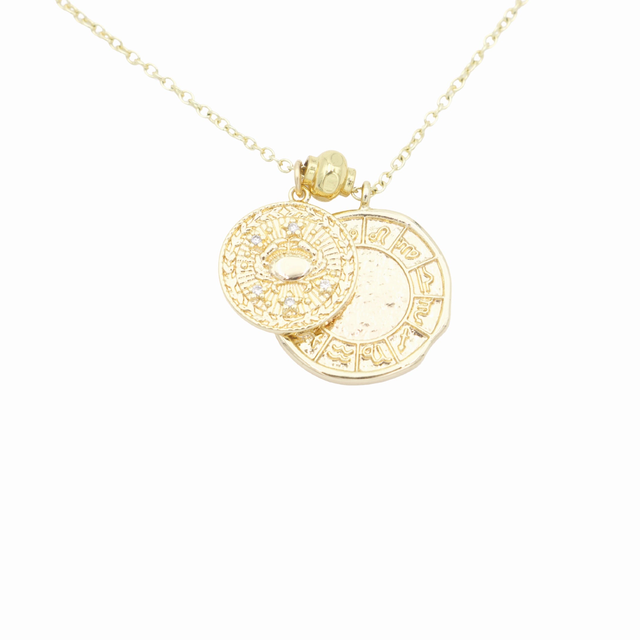 AW Boutique's dual zodiac coin necklace featuring a dainty necklace chain, zodiac rustic coin charm, and your chosen star sign coin charm. Charms separated by a gold bead. Part of the Celestial Collection. Gold filled jewellery. Option shown is Cancer.