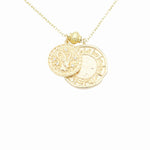 Load image into Gallery viewer, AW Boutique&#39;s dual zodiac coin necklace featuring a dainty necklace chain, zodiac rustic coin charm, and your chosen star sign coin charm. Charms separated by a gold bead. Part of the Celestial Collection. Gold filled jewellery. Option shown is Capricorn.
