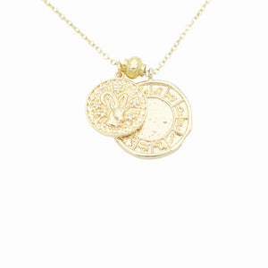 AW Boutique's dual zodiac coin necklace featuring a dainty necklace chain, zodiac rustic coin charm, and your chosen star sign coin charm. Charms separated by a gold bead. Part of the Celestial Collection. Gold filled jewellery. Option shown is Capricorn.