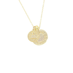 AW Boutique's dual zodiac coin necklace featuring a dainty necklace chain, zodiac rustic coin charm, and your chosen star sign coin charm. Charms separated by a gold bead. Part of the Celestial Collection. Gold filled jewellery. Option shown is Gemini.