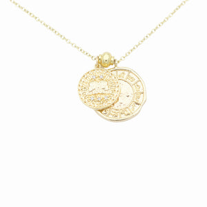 AW Boutique's dual zodiac coin necklace featuring a dainty necklace chain, zodiac rustic coin charm, and your chosen star sign coin charm. Charms separated by a gold bead. Part of the Celestial Collection. Gold filled jewellery. Option shown is Gemini.