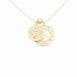 AW Boutique's dual zodiac coin necklace featuring a dainty necklace chain, zodiac rustic coin charm, and your chosen star sign coin charm. Charms separated by a gold bead. Part of the Celestial Collection. Gold filled jewellery. Option shown is Libra.