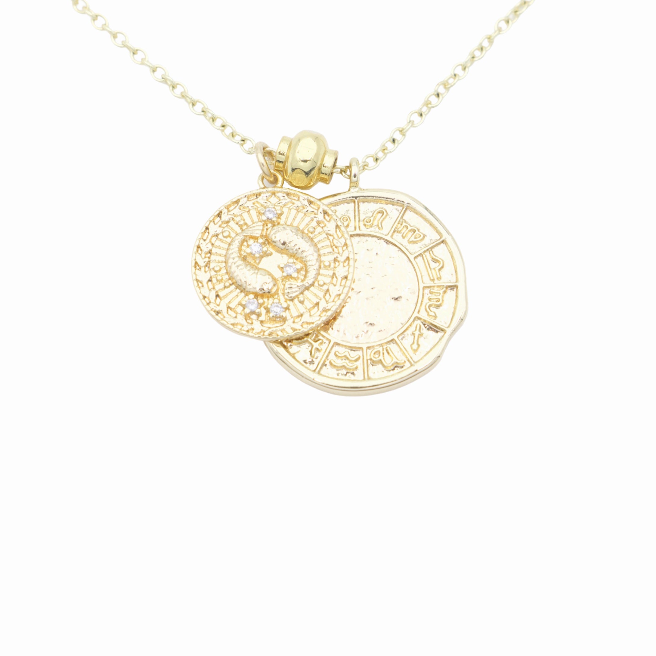 AW Boutique's dual zodiac coin necklace featuring a dainty necklace chain, zodiac rustic coin charm, and your chosen star sign coin charm. Charms separated by a gold bead. Part of the Celestial Collection. Gold filled jewellery. Option shown is Pisces.