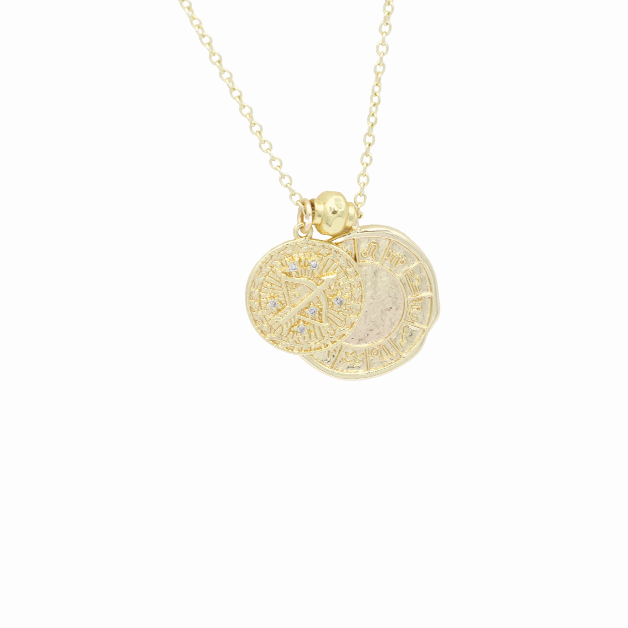 AW Boutique's dual zodiac coin necklace featuring a dainty necklace chain, zodiac rustic coin charm, and your chosen star sign coin charm. Charms separated by a gold bead. Part of the Celestial Collection. Gold filled jewellery. Option shown is Sagittarius.
