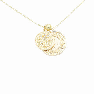 AW Boutique's dual zodiac coin necklace featuring a dainty necklace chain, zodiac rustic coin charm, and your chosen star sign coin charm. Charms separated by a gold bead. Part of the Celestial Collection. Gold filled jewellery. Option shown is Virgo.
