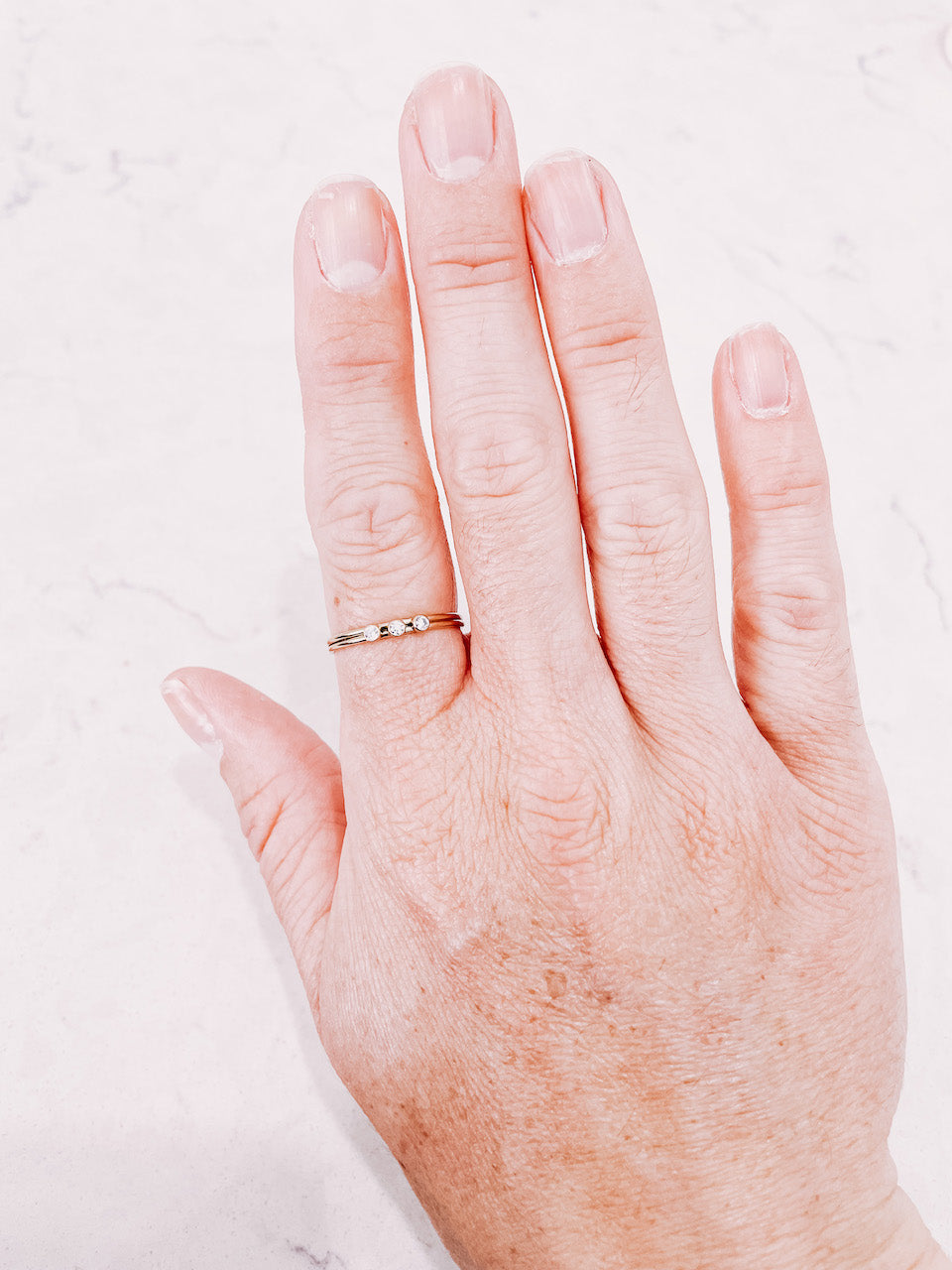 Triple Stone Stacker ring worn on hand by lady startup Australian jewellery label, AW Boutique.
